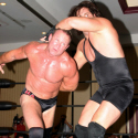 Brad Anderson works on Brad Armstrong's arm