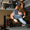 Kid Kash leaps over a charging Timber