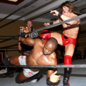 Elix Skipper gets nailed from behind by Petey Williams
