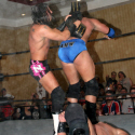 Andy Douglas clobbers James Storm with the championship belt